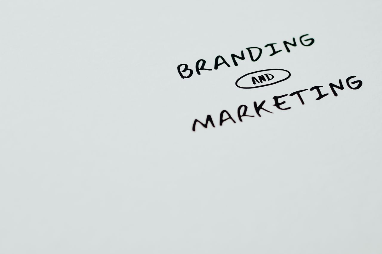 services-01 A minimalist image featuring the words Branding and Marketing on a white background, ideal for digital marketing themes.
